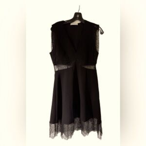 Hardly worn black dress with mesh cutouts